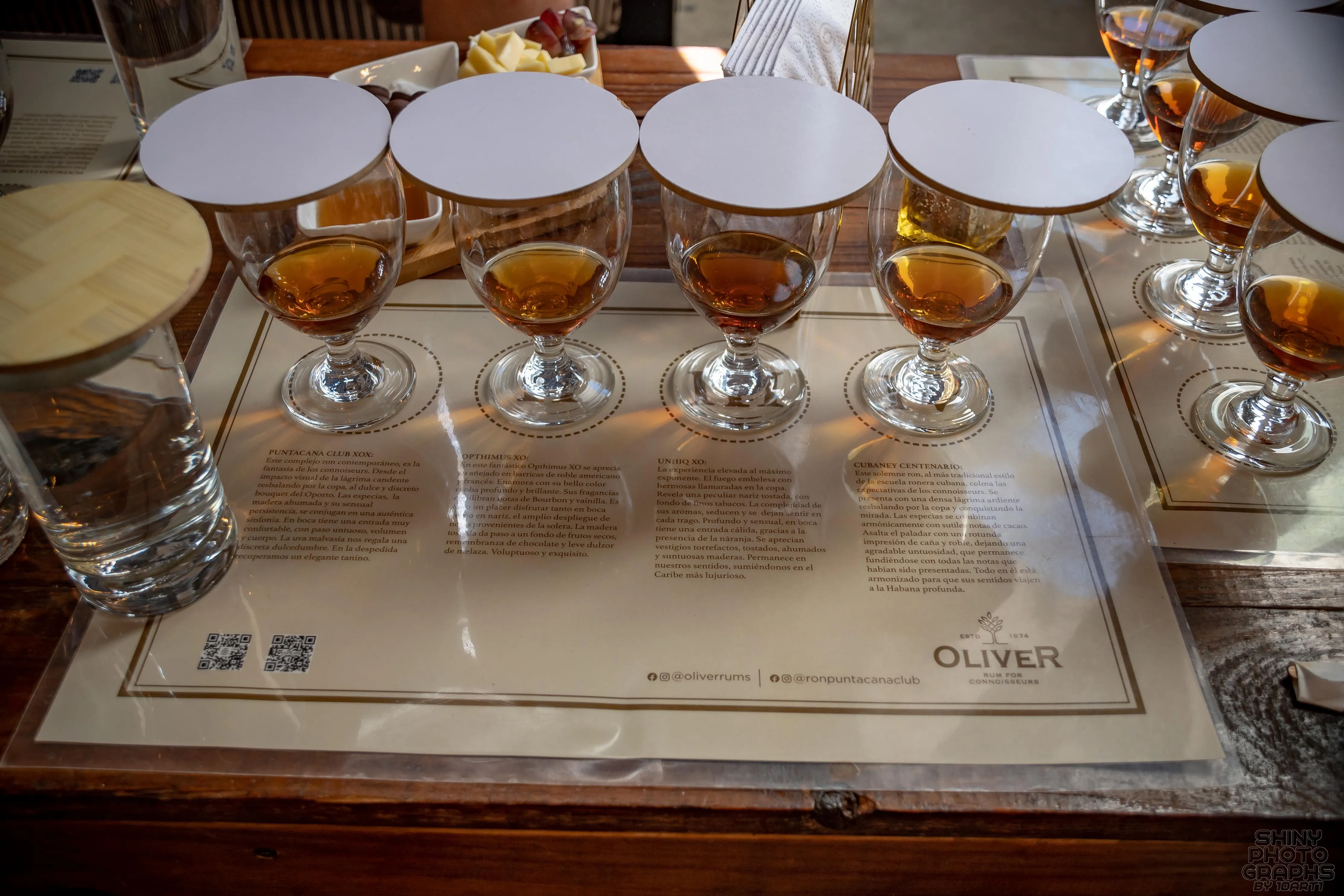 A row of four glasses of rum